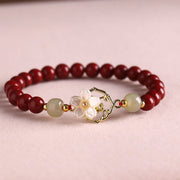 Bracelet fleur de bénédiction en cinabre naturel, jade et tridacne de Foviel