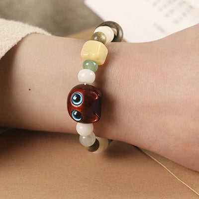 Bracelet de paix Foviel avec tête et patte de chat en graine de Bodhi, bois de santal vert, bois d'ébène et bois de santal rouge à petites feuilles