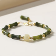 Bracelet chaîne Foviel avec perle de verre et bambou, symbole de chance et de force