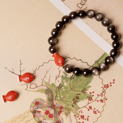 Bracelet Foviel en obsidienne argentée naturelle, cinabre et motif de poisson koï pour une protection apaisante
