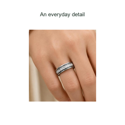 close-up of a silver-tone clear-stone ring worn on a hand.