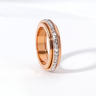 Rose gold spinner ring with clear square faceted stones