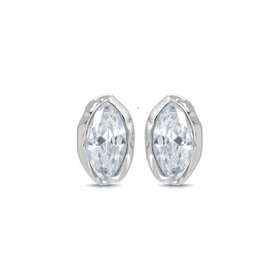Clear marquise cubic zirconia studs in silver-tone settings on white